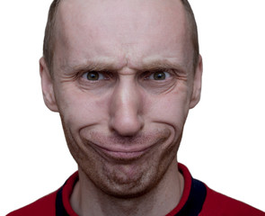 Portrait of unshaven caucasian man with funny face. Positive emotions. Play the ape. Close-up portrait. Isolated on white.