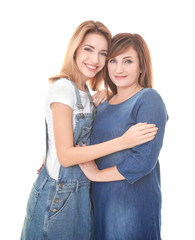 Attractive young woman with her mother on white background