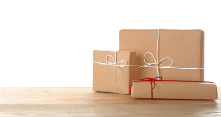 Parcel gift boxes on table against white background