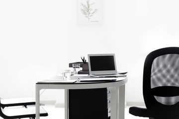 Workplace of notary with laptop in office