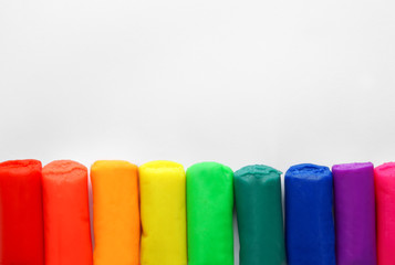 Rainbow play dough on white background