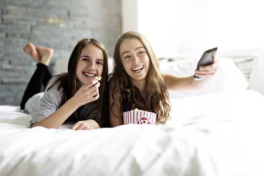 friendship, people, pajama party, entertainment and junk food concept