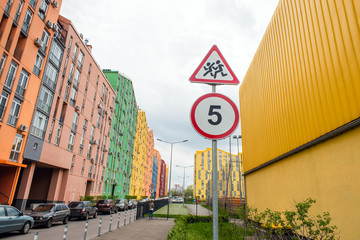 Clildren on the road sign and 5 km speed limit sign near the school