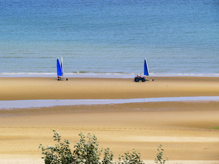 Omaha Beach, Normandy, France. Sail Karts on the Omaha Beach. Omaha is famous for the Normandy landings on June 6,1944, during World War II.