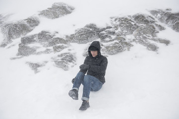 Fototapeta na wymiar Man in snow mountain bad weather