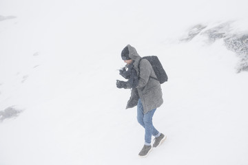 Fototapeta na wymiar Man in snow mountain bad weather