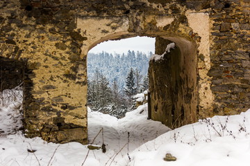 Winter day in ruins Divci Kamen, Czech Republic.