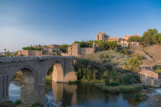 View of old stone bridge Puente de San Martín in Toledo, Spain