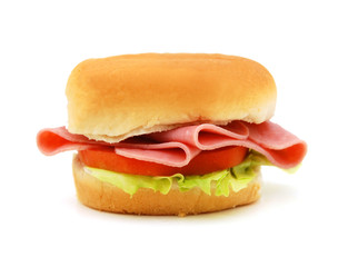 Sandwich with honey ham, swiss cheese, lettuce and tomatoes isolated on white