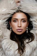 Fashion. Woman With Beauty Makeup In Fur