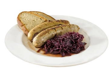Bratwurst, red cabbage and bread on a plate