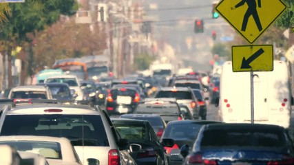 City street crowded cars in traffic jam hot day air turbulence Los Angeles