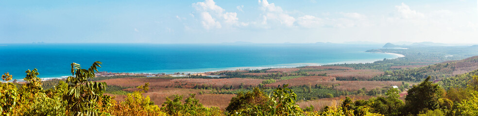 Viewpoint on Chumphon coastline from Buddha gold statue at Wat Khao Chedi-Phra Yai temple located on top of hill, Pathio, Chumphon district, Thailand