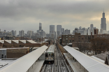Chicago skyline with subway in foreground with snow