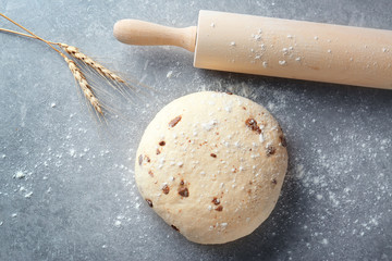 Raw dough with chocolate chips on table