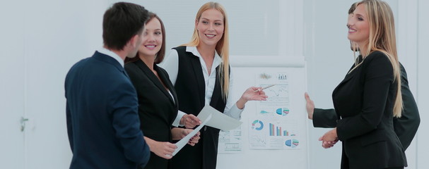 Manager of the company holds a working meeting before the busine