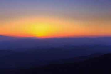 Silhouettes of the mountain hills at sunset. mountain cascade