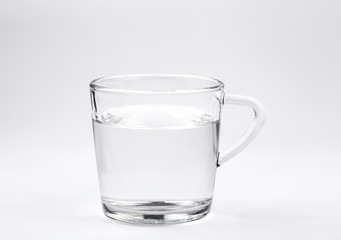 water in glass with white background