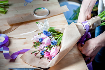 The florist assemble a bouquet