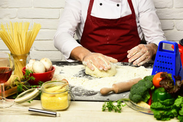 Chef makes dough. Professional cookery concept.