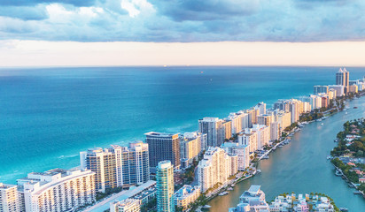 Naklejka premium Miami Beach skyscrapers at dusk, Florida. Beautiful view from helicopter