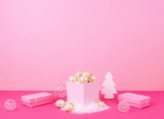 Fototapeta na wymiar Christmas tree balls on a pink background