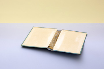Still life with a cover from an old book