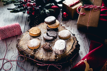 Traditional Spanish Christmas candy. Andalusian Shortbread cookies (Polvorones) on on oak tree trunk