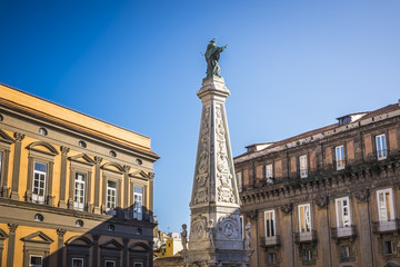 The obelisk of San domenico church and square in Naples, Italy