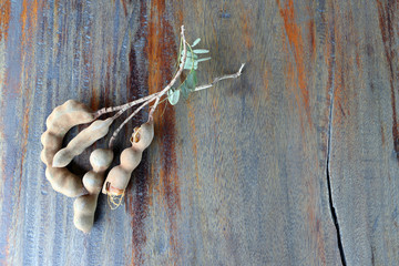 Tamarind on the wooden table background.