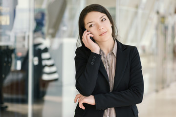 Young girl speaking by phone. Selective focus.