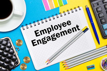 Employee Engagement notes in the notebook on the Desk of a businessman in office. Business concept Employee Engagement.