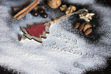 Christmas Decoration and walnuts, almonds, pine nuts, cinnamon, chocolate