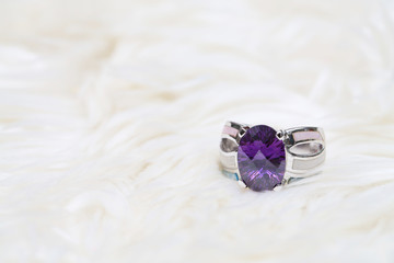 Fototapeta na wymiar purple gemstone on silver ring