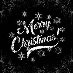 Holiday greetings quote-Merry Christmas-with a snowflakes on black chalkboard. Great for Christmas and New year cards, flyers, posters, brochures, gift tags, invitation.