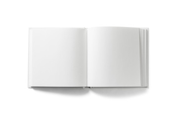 Open blank book on white background. Isolated with clipping path. Flat lay.