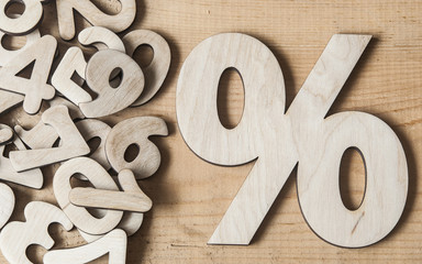 sign percent on wooden table