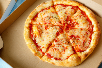 Delivery box with delicious pizza