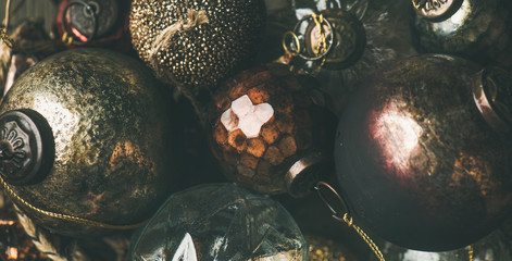 Flat-lay of vintage Christmas or New Year holiday tree decoration balls, top view. Holiday greeting card background, wide composition