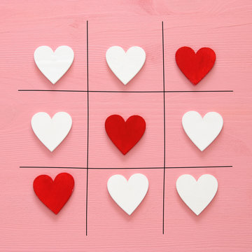 Valentine's day concept with hearts X-O game. Tic tac toe game concept.Top view.