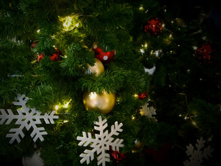 Close-up christmas tree have gold and silver ball and snowflake for background