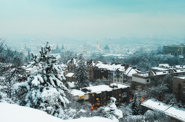 Winter panorama and aerial view from the Lion Hill on the downtown in Lviv, Ukraine. Old city and buildings with roofs covered with snow