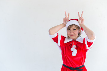 Obraz premium Beautiful young asian woman in Santa Claus clothes on white background,Thailand people,Sent happiness for children,Merry christmas,Welcome to winter,Happy woman concept