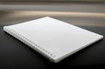 Close up of the white blank note book