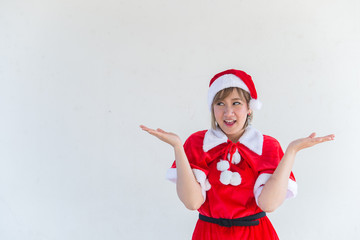 Fototapeta na wymiar Beautiful young asian woman in Santa Claus clothes on white background,Thailand people,Sent happiness for children,Merry christmas,Welcome to winter,Happy woman concept