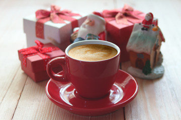 Red coffee cup with background christmas gift.