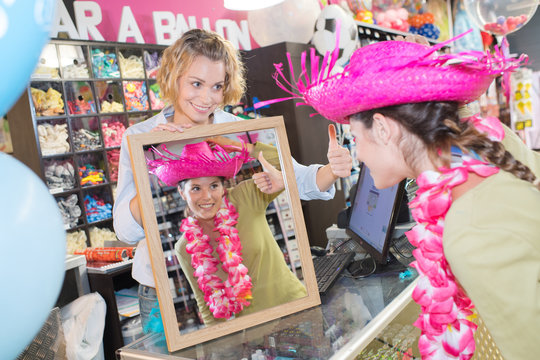 female buying dressing up accessoires
