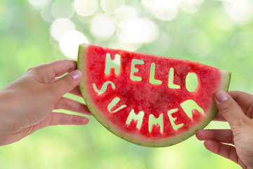 Hello summer concept - letters carved from watermelon