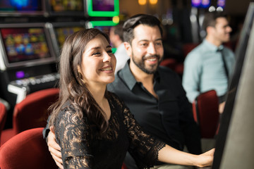 Happy couple having fun in a casino