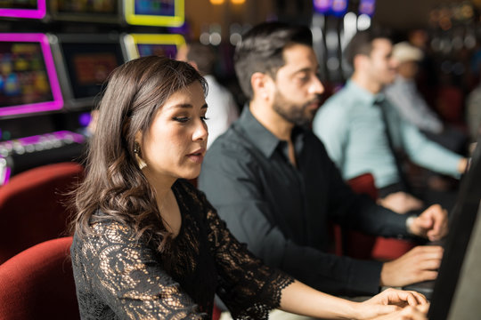 Woman playing in a slot machine